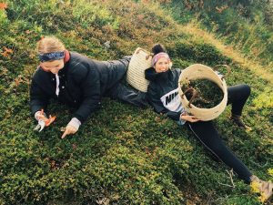 Girls picking herbs
